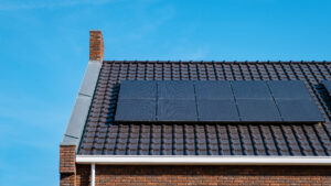 Newly build houses with solar panels attached on roof against a sunny sky Close up of solar pannel