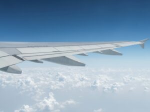 airplane wing in the sky, travel by plane